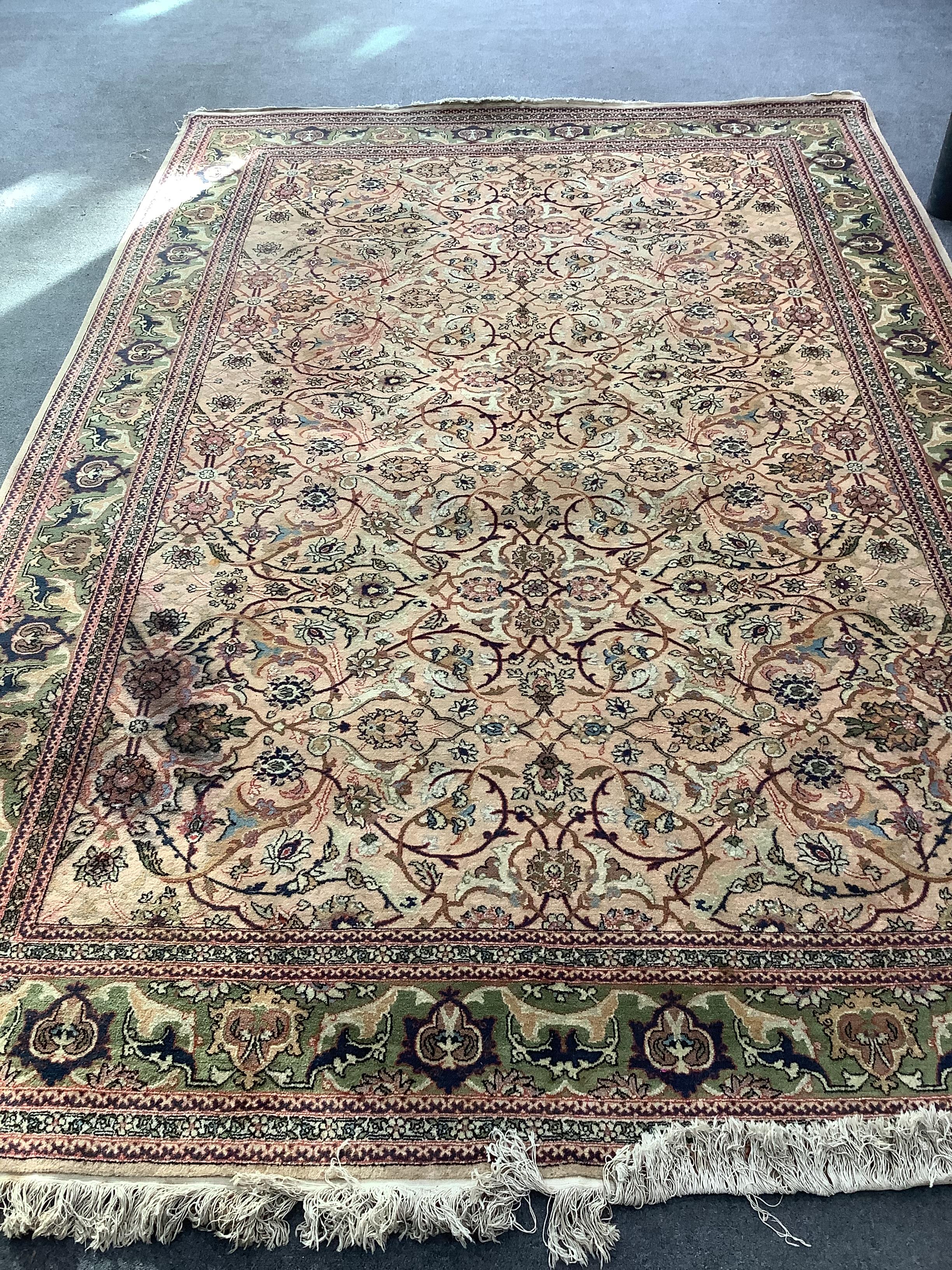 A North West Persian style peach ground carpet, 306 x 205cm